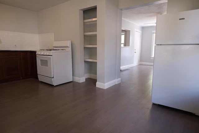 4737 Jefferson St, Houston, TX 77023 - kitchen featuring white appliances, dark wood finished floors, decorative backsplash, baseboards, and dark brown cabinets