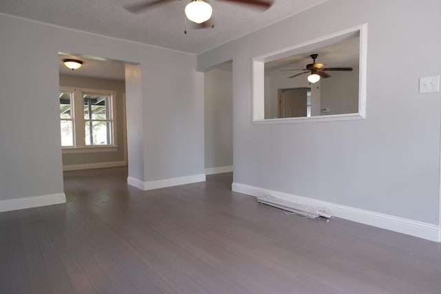 4737 Jefferson St, Houston, TX 77023 - spare room featuring a ceiling fan, dark wood-style flooring, and baseboards