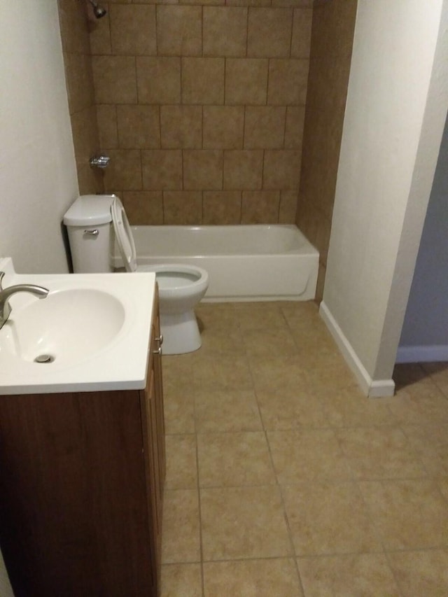 2152 William Tell St, Houston, TX 77093 - bathroom featuring toilet, vanity, tile patterned flooring, baseboards, and bathing tub / shower combination