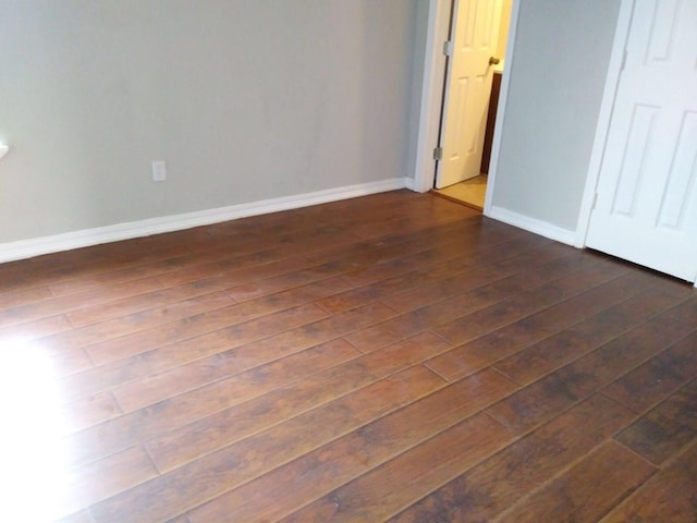 2152 William Tell St, Houston, TX 77093 - unfurnished bedroom featuring dark wood-type flooring and baseboards