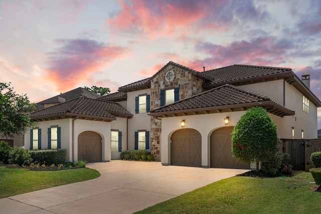 6407 Caparra Rock Ln, Sugar Land, TX 77479 - mediterranean / spanish-style home featuring a garage, a tile roof, driveway, stucco siding, and stone siding