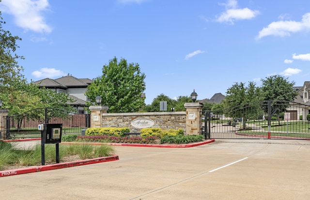 6407 Caparra Rock Ln, Sugar Land, TX 77479 - community / neighborhood sign featuring a gate
