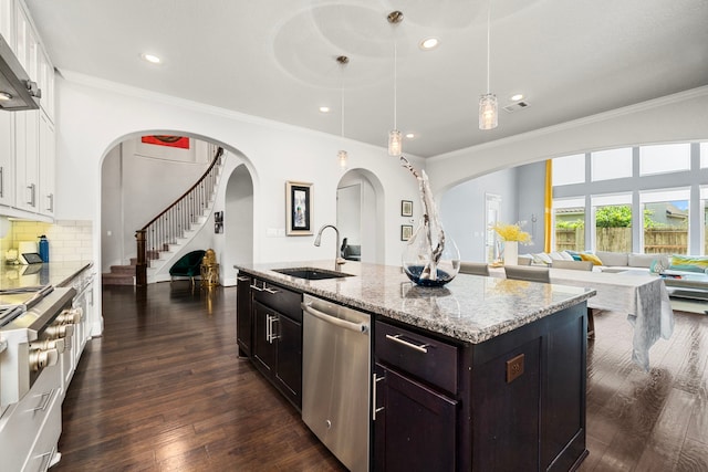 6407 Caparra Rock Ln, Sugar Land, TX 77479 - kitchen with a sink, stainless steel dishwasher, arched walkways, ornamental molding, and white cabinets