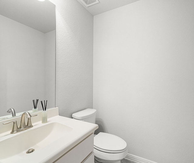 6407 Caparra Rock Ln, Sugar Land, TX 77479 - bathroom with vanity, toilet, and a textured wall
