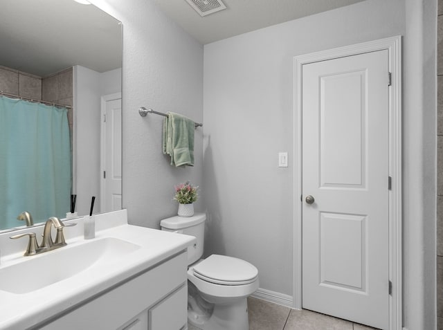6407 Caparra Rock Ln, Sugar Land, TX 77479 - bathroom featuring vanity, toilet, tile patterned flooring, and curtained shower