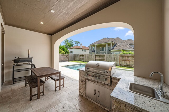 6407 Caparra Rock Ln, Sugar Land, TX 77479 - fenced backyard featuring a sink and a patio area
