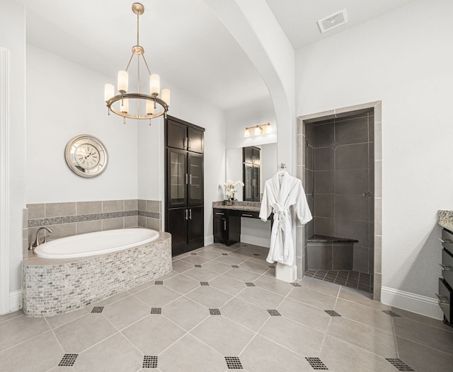 6407 Caparra Rock Ln, Sugar Land, TX 77479 - full bathroom featuring vanity, a bath, a chandelier, and tile patterned flooring