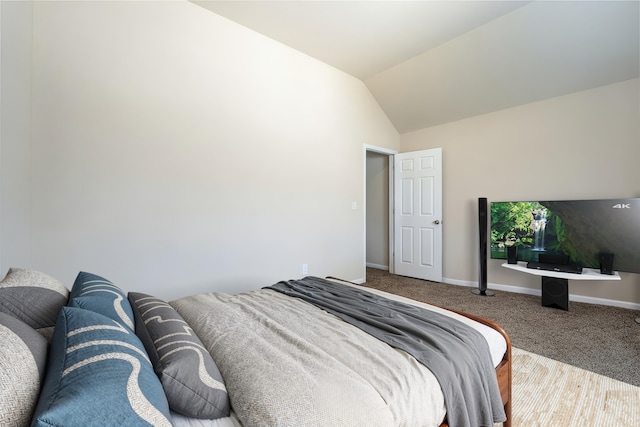 10531 Sunflower Dr, Willis, TX 77318 - bedroom featuring carpet floors, lofted ceiling, and baseboards