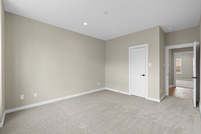 11326 Stonework Grove Ln, Houston, TX 77076 - unfurnished bedroom with carpet flooring, baseboards, and recessed lighting