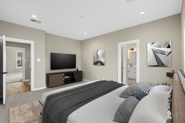 11326 Stonework Grove Ln, Houston, TX 77076 - bedroom with carpet flooring, baseboards, recessed lighting, and connected bathroom
