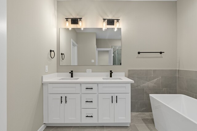 11326 Stonework Grove Ln, Houston, TX 77076 - full bath with a freestanding bath, double vanity, and a shower with shower door
