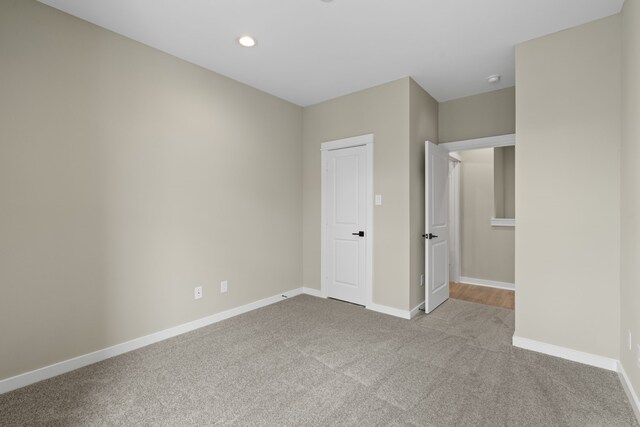 11326 Stonework Grove Ln, Houston, TX 77076 - unfurnished bedroom with carpet flooring, baseboards, and recessed lighting