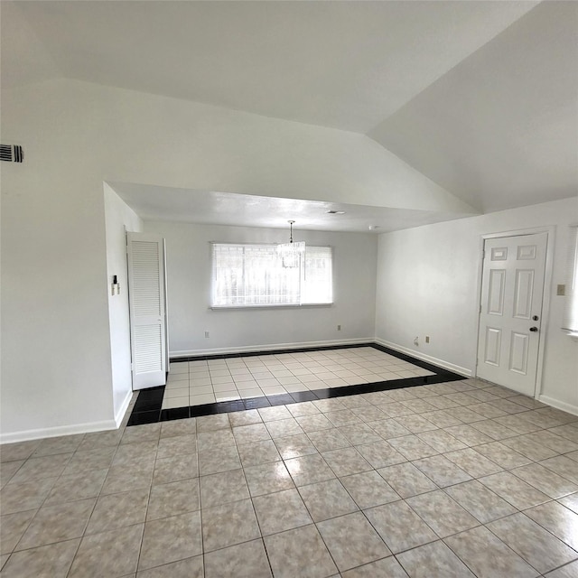 17223 Artwood Ln, Houston, TX 77489 - tiled empty room featuring vaulted ceiling, a chandelier, and baseboards