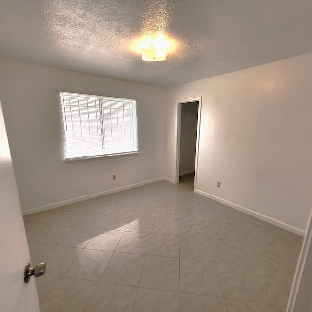 17223 Artwood Ln, Houston, TX 77489 - empty room featuring a textured ceiling and baseboards