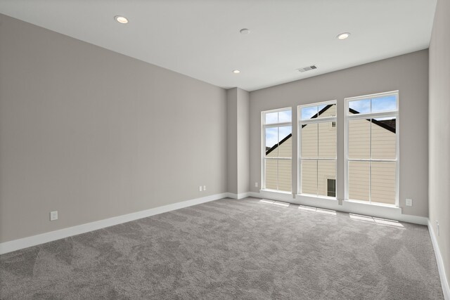 1139 W 22nd St, Houston, TX 77008 - empty room featuring carpet floors, baseboards, and recessed lighting