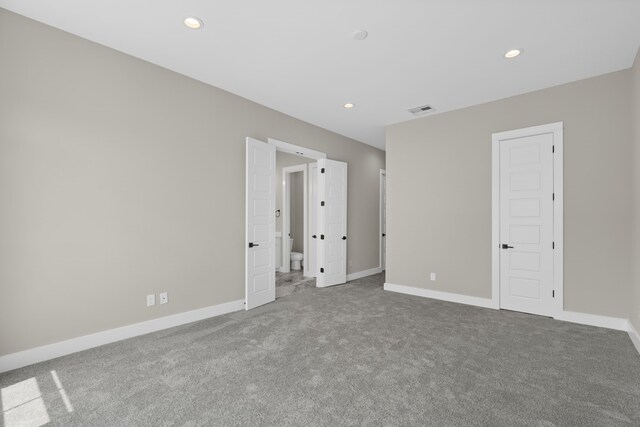 1139 W 22nd St, Houston, TX 77008 - carpeted empty room with baseboards and recessed lighting