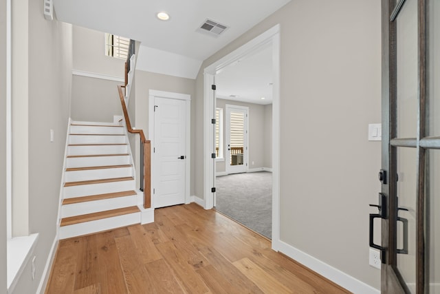 1139 W 22nd St, Houston, TX 77008 - foyer featuring baseboards, light wood-style floors, stairs, and recessed lighting