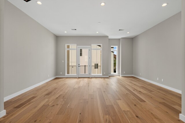 1139 W 22nd St, Houston, TX 77008 - spare room featuring baseboards, light wood-style floors, and recessed lighting
