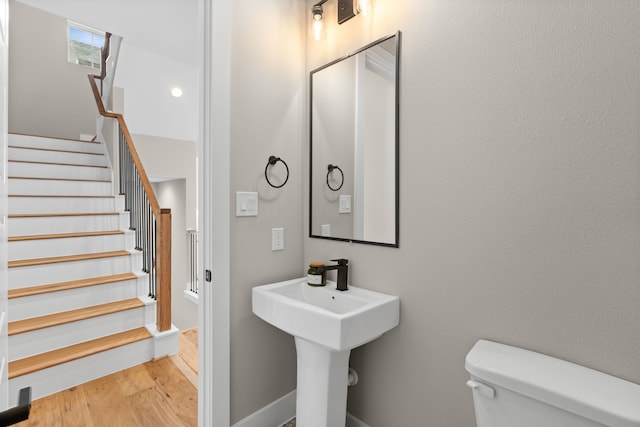 1139 W 22nd St, Houston, TX 77008 - half bathroom with toilet and wood finished floors