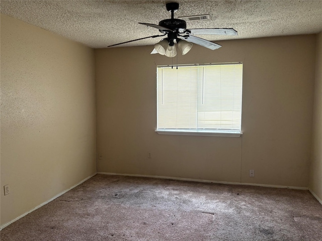4934 Deerwood Cir, Baytown, TX 77521 - spare room featuring a ceiling fan, carpet, a textured ceiling, and baseboards