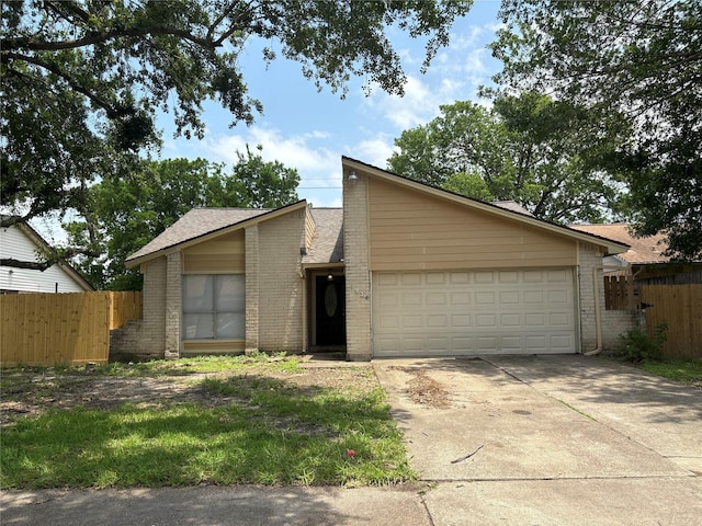 4934 Deerwood Cir, Baytown, TX 77521 - mid-century home with brick siding, concrete driveway, an attached garage, and roof with shingles