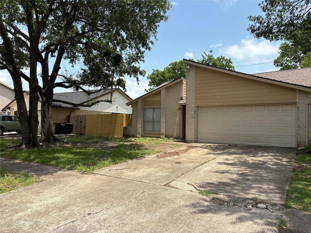 4934 Deerwood Cir, Baytown, TX 77521 - mid-century inspired home featuring brick siding, driveway, and a garage