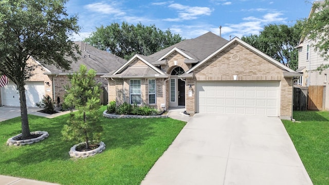 7315 Palmito Ranch Dr, Richmond, TX 77406 - ranch-style house featuring brick siding, a garage, concrete driveway, and a shingled roof