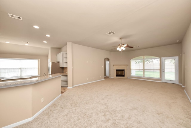 7315 Palmito Ranch Dr, Richmond, TX 77406 - unfurnished living room with baseboards, healthy amount of natural light, light carpet, and recessed lighting