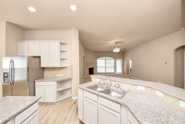 7315 Palmito Ranch Dr, Richmond, TX 77406 - kitchen with stainless steel fridge, open shelves, a sink, tasteful backsplash, and ceiling fan