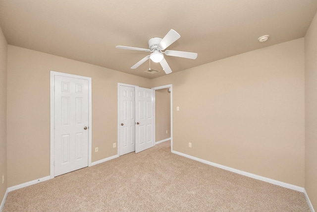 7315 Palmito Ranch Dr, Richmond, TX 77406 - unfurnished bedroom featuring light colored carpet, baseboards, and ceiling fan