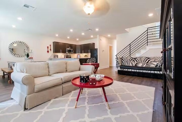 442 William D Fitch, College Station, TX 77845 - living room with stairway, wood finished floors, recessed lighting, and baseboards