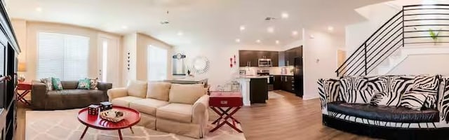 442 William D Fitch, College Station, TX 77845 - living area with light wood-style floors and stairway