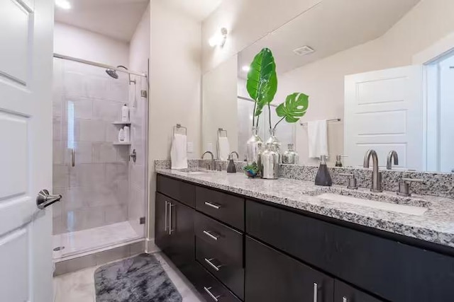 442 William D Fitch, College Station, TX 77845 - bathroom with double vanity, a shower stall, and tile patterned flooring