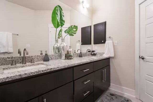 442 William D Fitch, College Station, TX 77845 - full bathroom featuring double vanity, baseboards, and tile patterned floors