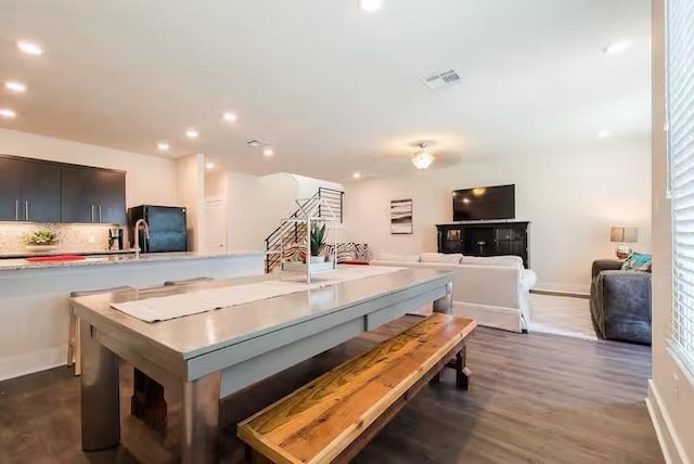 442 William D Fitch, College Station, TX 77845 - dining space featuring dark wood-style flooring, stairs, recessed lighting, and baseboards