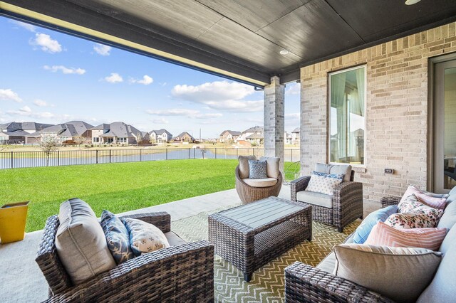453 Stratus View Ct, Katy, TX 77493 - view of patio featuring a residential view, an outdoor living space, and a water view