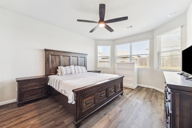 3685 Cub Dr, Conroe, TX 77301 - bedroom featuring dark wood-style flooring, baseboards, and ceiling fan