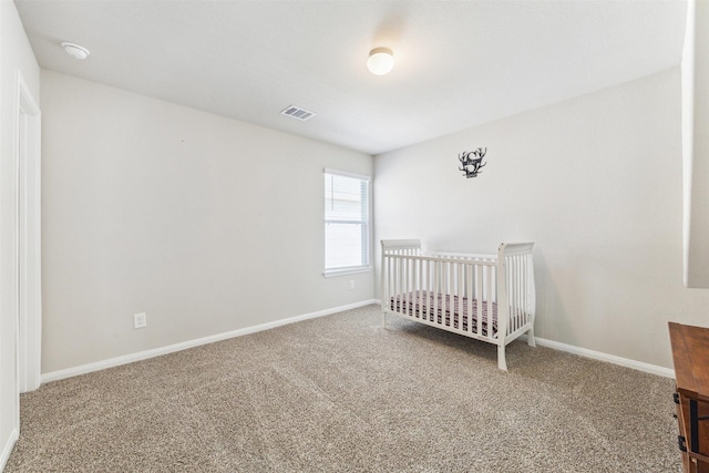 3685 Cub Dr, Conroe, TX 77301 - carpeted bedroom with baseboards and a crib