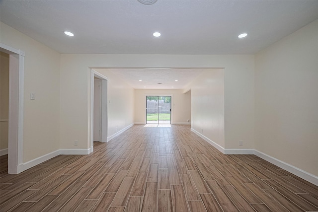 7130 Walkway St, Houston, TX 77036 - empty room with wood finished floors, baseboards, and recessed lighting
