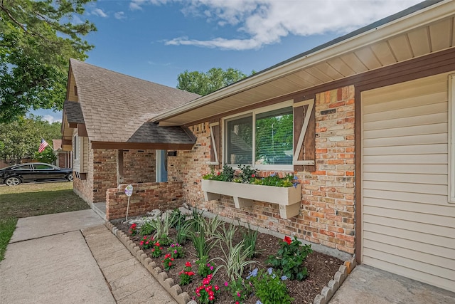 7130 Walkway St, Houston, TX 77036 - view of property exterior with brick siding and a shingled roof