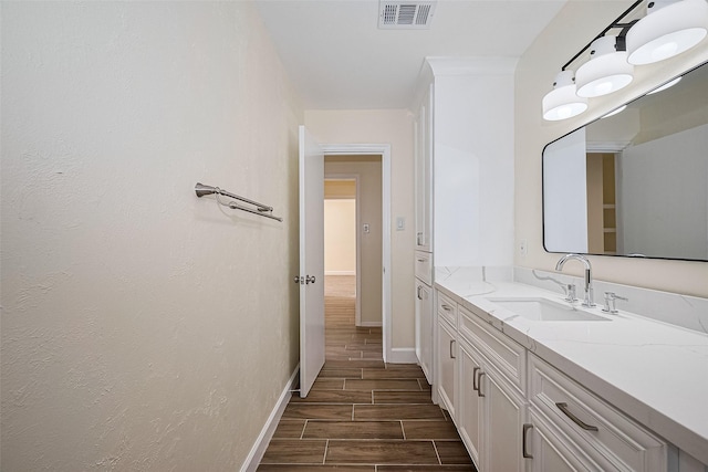 7130 Walkway St, Houston, TX 77036 - bathroom with vanity, wood finish floors, and baseboards