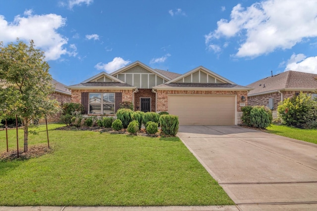 2314 Brickfielder Ln, Baytown, TX 77523 - view of front facade with concrete driveway, an attached garage, brick siding, and a front yard