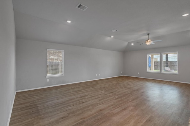 2314 Brickfielder Ln, Baytown, TX 77523 - unfurnished room with lofted ceiling, wood finished floors, ceiling fan, and recessed lighting