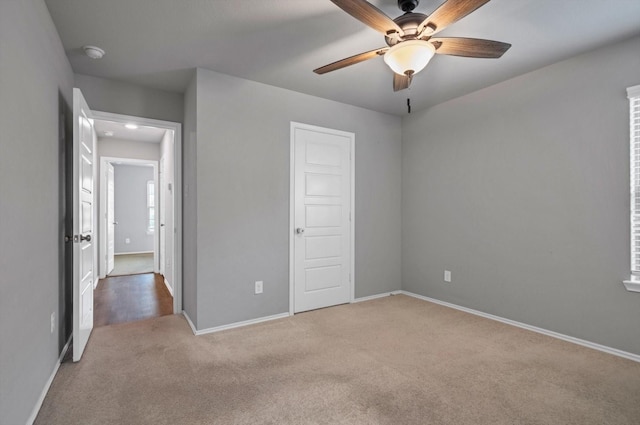 2314 Brickfielder Ln, Baytown, TX 77523 - unfurnished bedroom featuring carpet and a ceiling fan