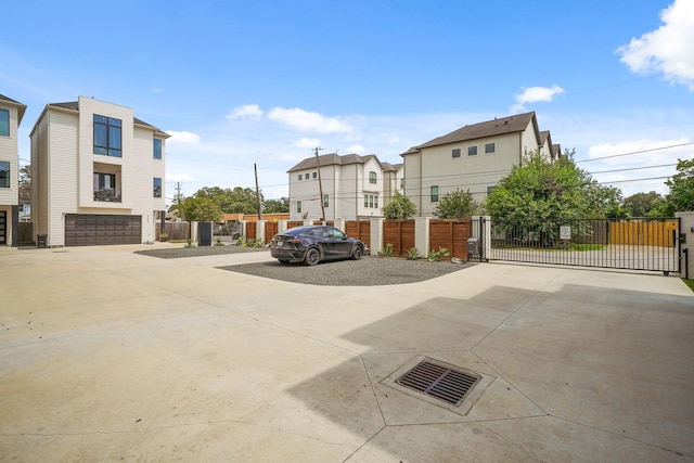 828 Wakefield Dr Unit B, Houston, TX 77018 - view of vehicle parking with driveway, a gate, and a residential view