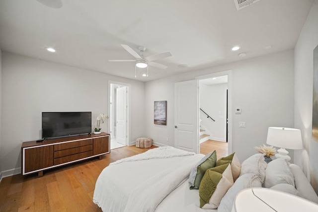 828 Wakefield Dr Unit B, Houston, TX 77018 - bedroom featuring recessed lighting, wood finished floors, baseboards, a ceiling fan, and ensuite bath