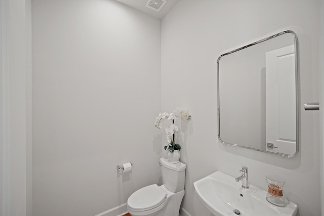 828 Wakefield Dr Unit B, Houston, TX 77018 - bathroom with a sink, toilet, and baseboards