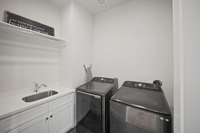 828 Wakefield Dr Unit B, Houston, TX 77018 - laundry area with cabinet space and washer and dryer