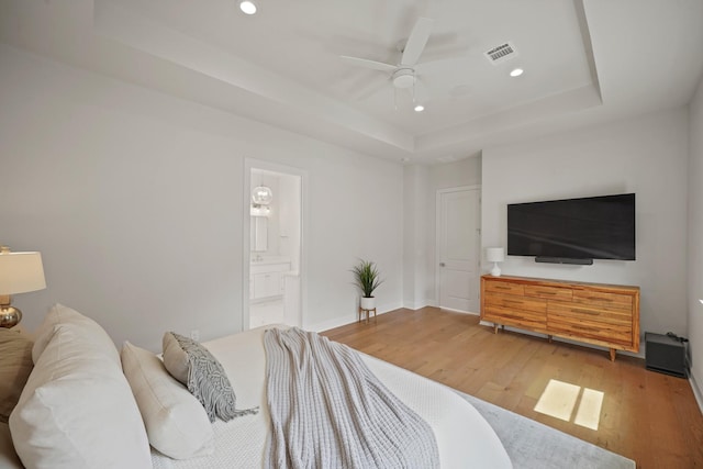 828 Wakefield Dr Unit B, Houston, TX 77018 - bedroom with a raised ceiling, recessed lighting, wood finished floors, ensuite bath, and baseboards