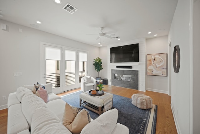 828 Wakefield Dr Unit B, Houston, TX 77018 - living area featuring a ceiling fan, a fireplace, baseboards, recessed lighting, and wood finished floors